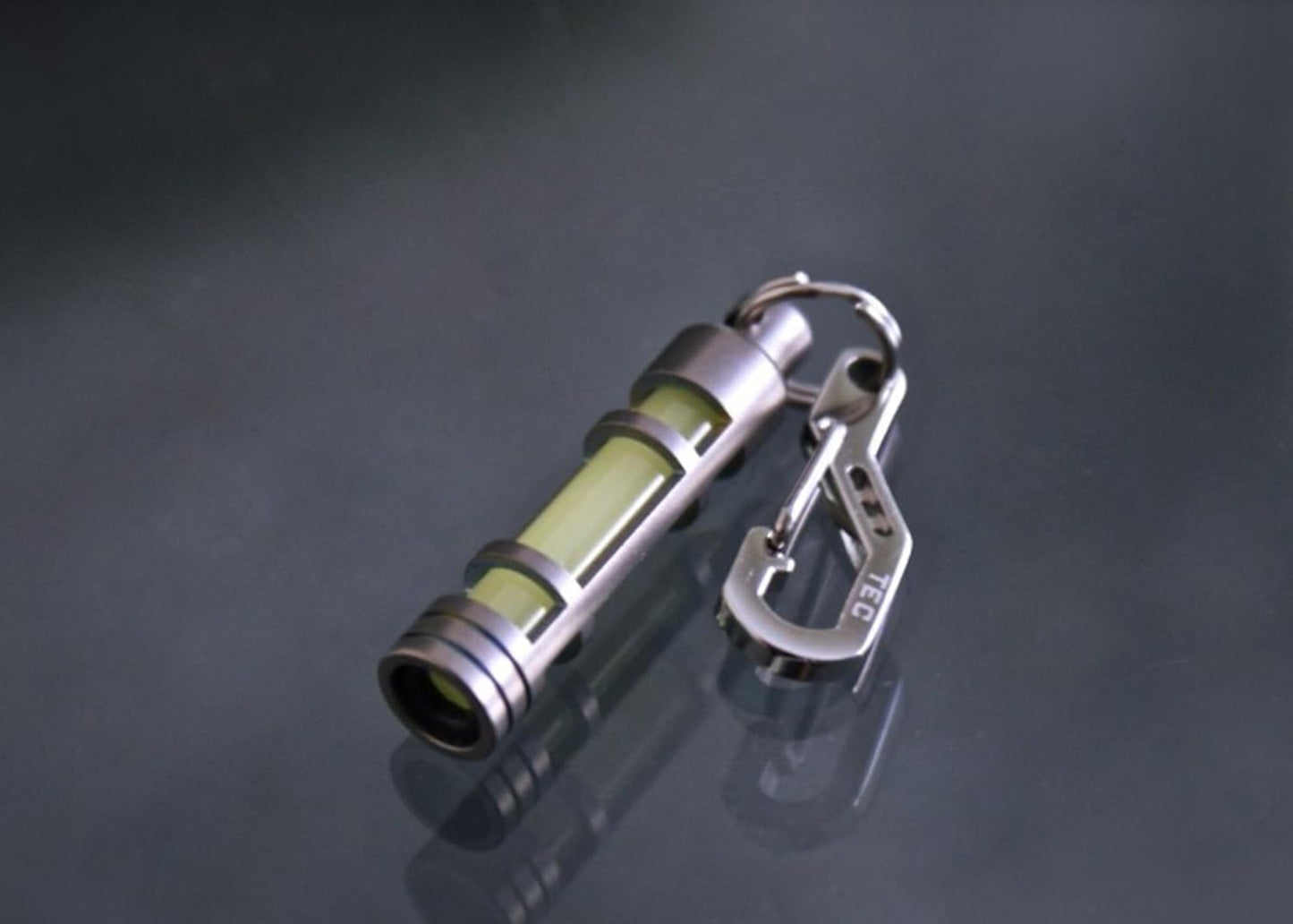 TEC Accessories Embrite Glow Fob - Titanium, Green Embrite Pellet - Glow in the Dark Keychain Accessories - Everyday Carry Key Fob Keychain for Indoor and Outdoor Use, Green, 0.38 x 0.38 x 1.75 inches